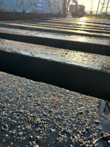 Wood Rail Ties Coated with Tietan Asphalt Costing to protect them from early failure